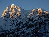 25 Phurbi Chyachu North Face Sunrise From Valley junction To Kong Tso Above Drakpochen The first rays of sunrise silhouette the north face of Phurbi Chyachu (6637m) from the valley junction to Kong Tso above Drakpochen.